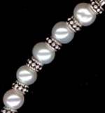 0049: Freshwater pearls with silver daisies necklace