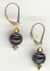 0120: black glass with bronze wire swirl spheres