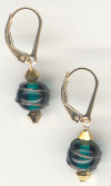 0121: Emerald green glass with bronze wire swirled spheres